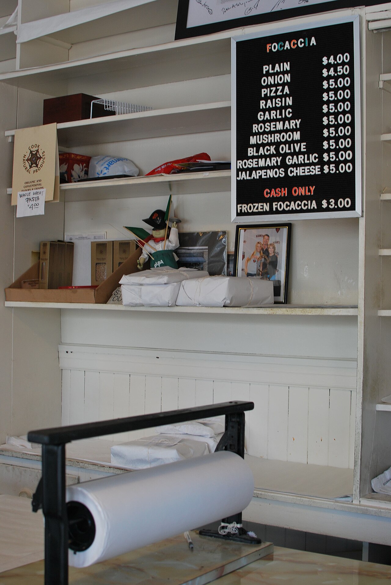 The board at Liguria Bakery, focaccia in the neighborhood since 1911